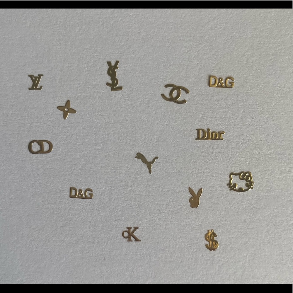 130 pcs Nail art designer logo in yellow gold